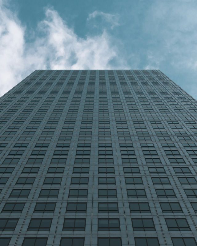Looking up a glass office tower in Canary Wharf